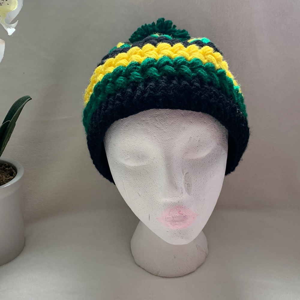 Black, green and gold hat.